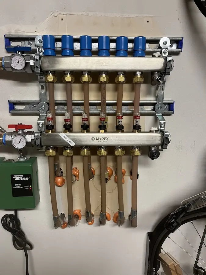 Plumber performing Water Heater Repair at a residential property in Denton